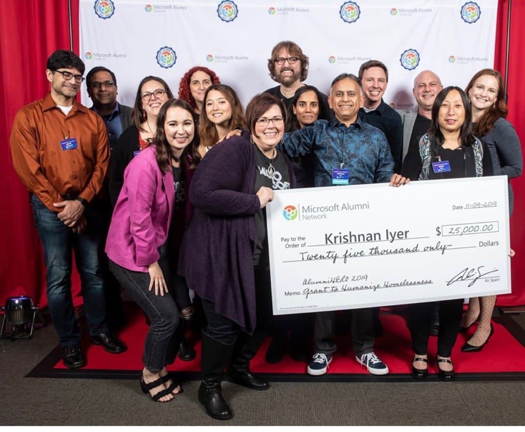 Krishnan Iyer receiving the 2019 Microsoft AlumniHERO award — a $25,000 grant to Humanize Homelessness